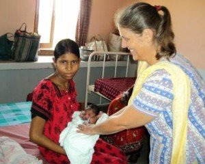 Commonwealth Scholar Lindsay Barnes (right) with a new mother at a women's health clinic