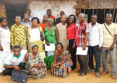 Nelly Shella Tchaptcheut Yonga (in red)  with a local solar management committee