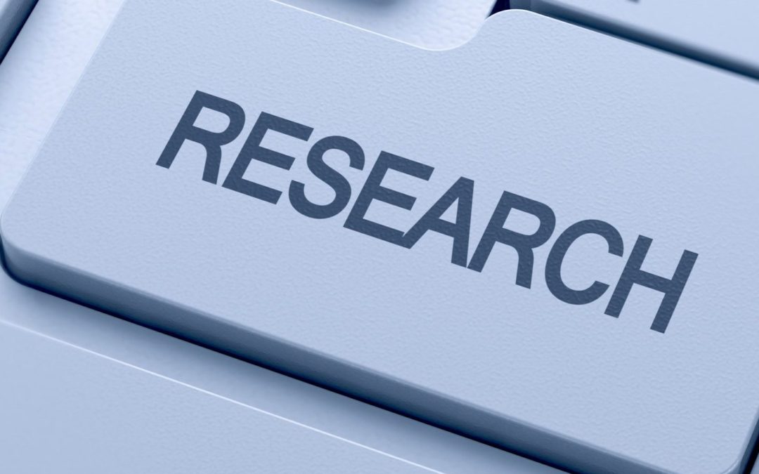Research word button on keyboard with soft focus