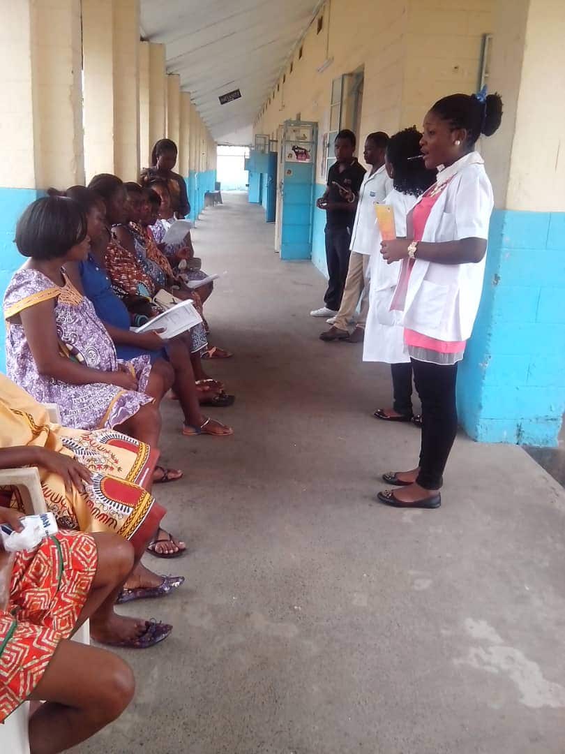 Acha Anwi Therese providing antenatal and health sensitisation to pregnant women in a hospital in Bota, Limbe