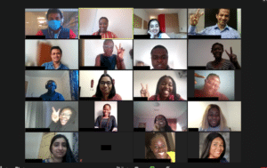 Video conference screen showing event participants smiling and waving