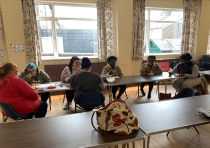 The Fellows participating in a workshop with other women