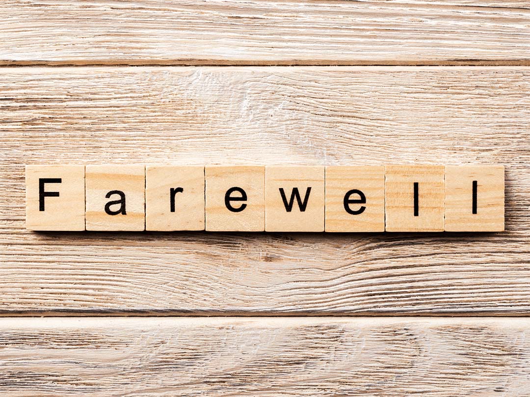 'FAREWELL' word written on wood blocks on table. 