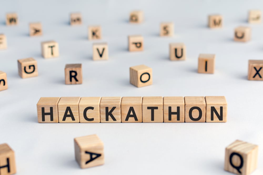 Letters on wooden cubes spelling out the word Hackathon