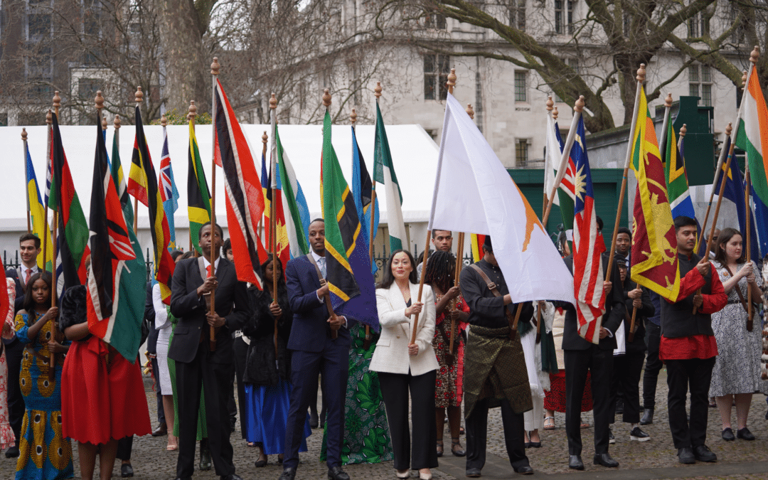 Commonwealth Day flag bearers standing together holding national flags.