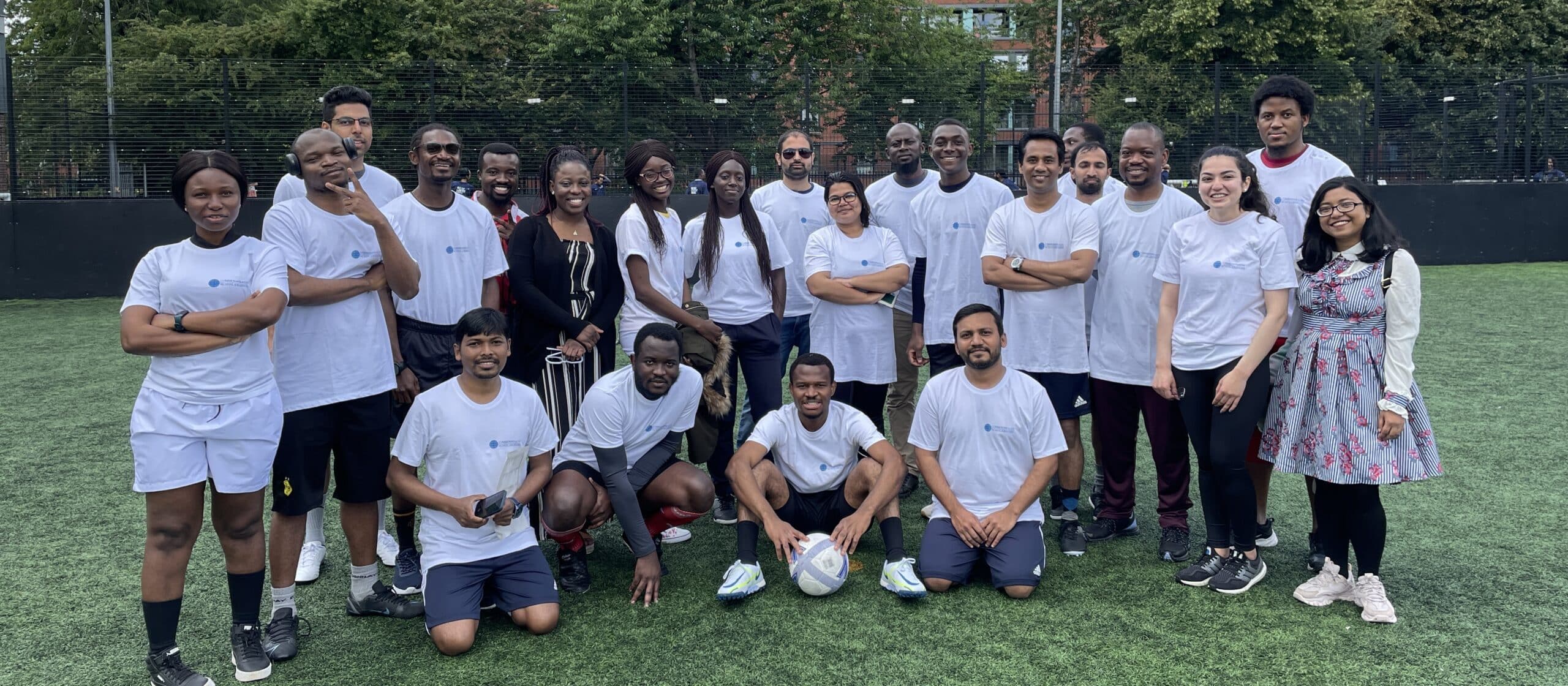 Commonwealth Scholars standing in a group before the CSC vs Chevening football match