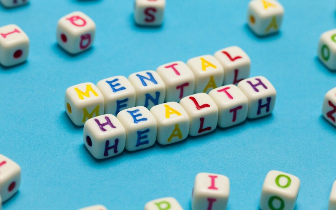 Small cube shapes with different letters arranged to spell out words: 'Mental Health'.