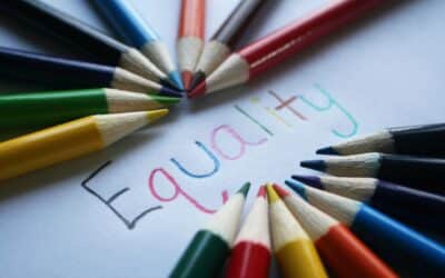 Coloured pencils arranged and the word 'Equality'.