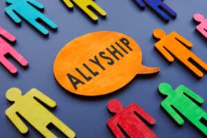 Allyship word on the quote plate and figures.