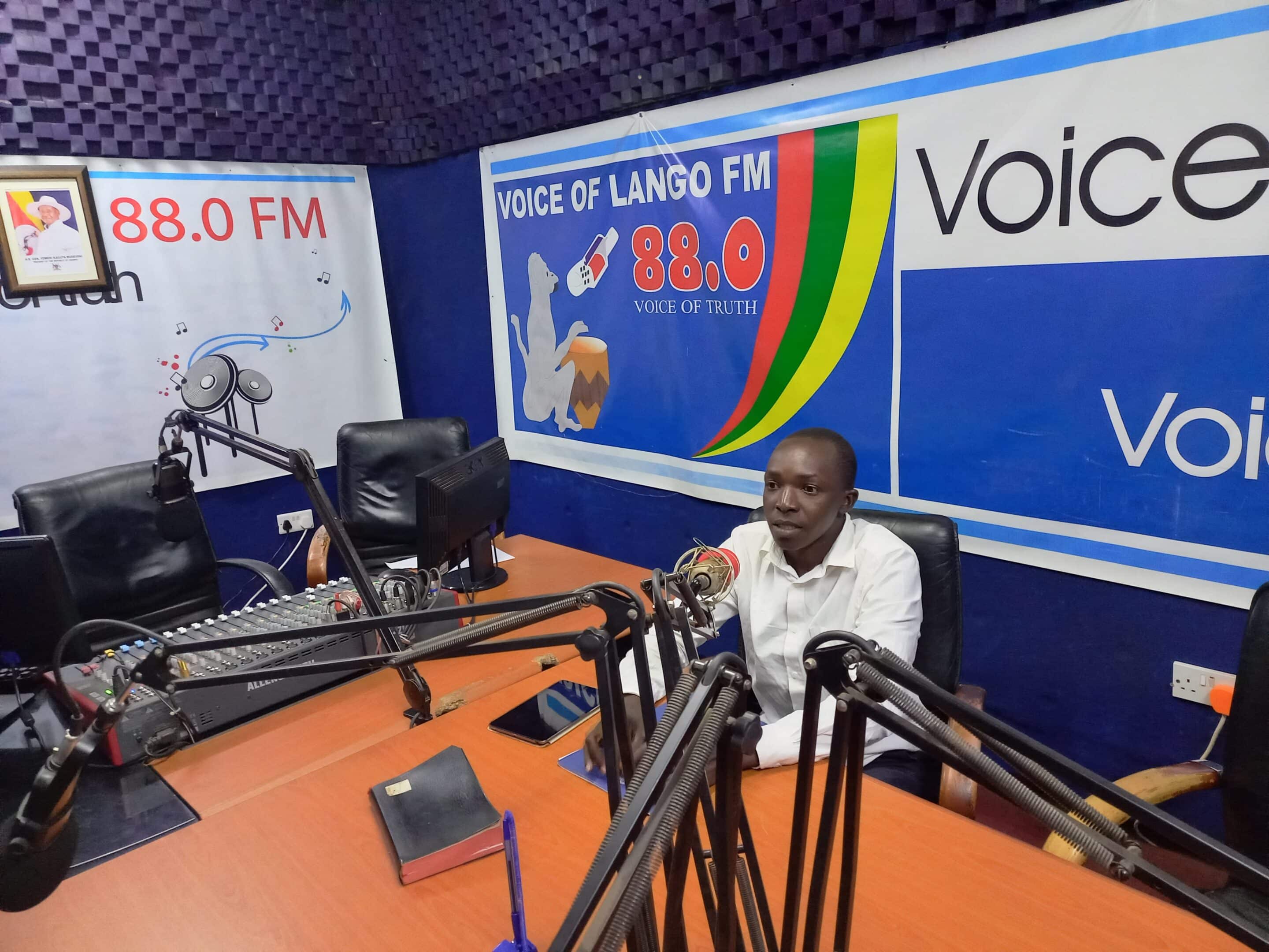 Fredrick Omara delivering a radio talk show on Voice of Lango FM-Lira