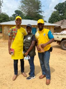 Three volunteers standing 