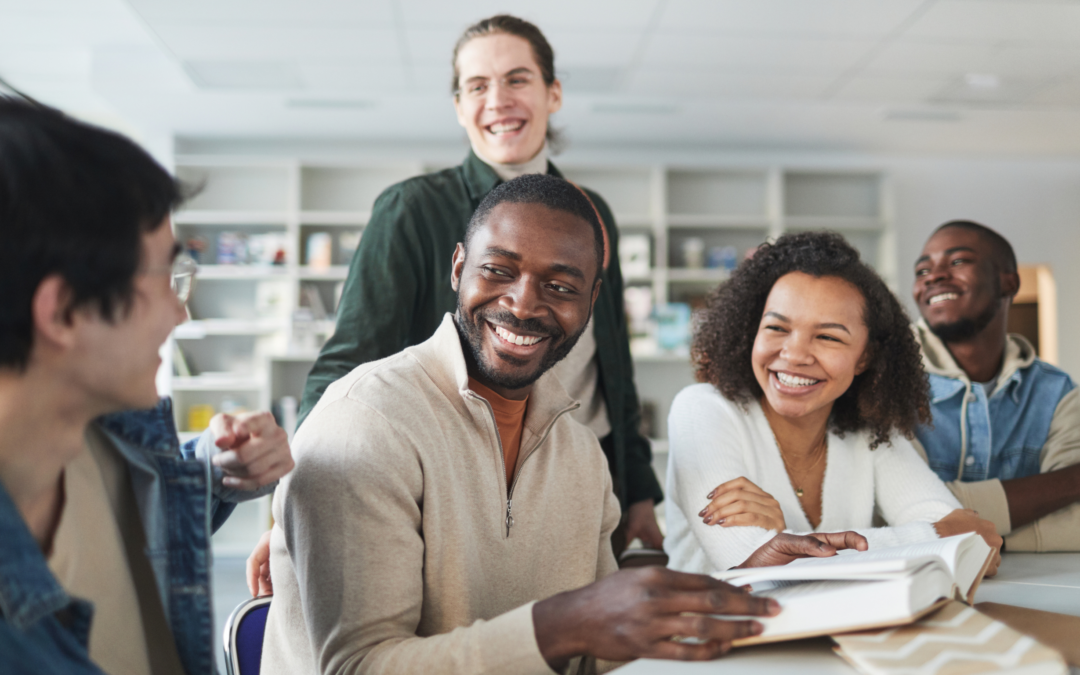 Students talking and studying in a library.