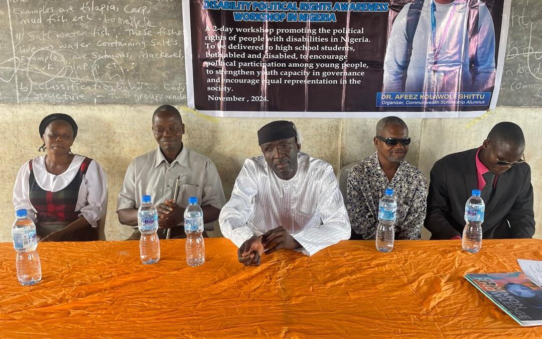 Speaker and guests sitting at a table