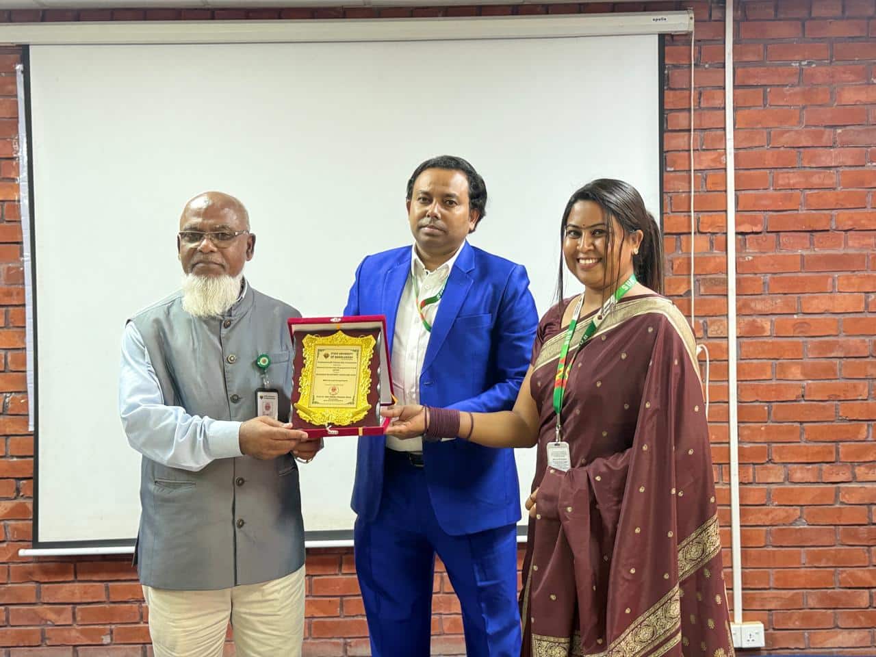 Man presenting crest to guest at the ACEF activity